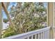 Overlooking the balcony is a lush tree with Spanish moss and other greenery at 133 Puffin Dr. # 3-E, Pawleys Island, SC 29585