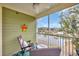 Screened porch features comfortable seating, fan and view of the lake at 133 Puffin Dr. # 3-E, Pawleys Island, SC 29585