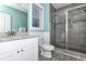 Charming bathroom features walk-in shower and vanity with granite countertop at 1411-A N Ocean Blvd., Surfside Beach, SC 29575