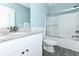 Bathroom featuring white cabinets, granite countertops, and a shower with sliding glass doors at 1411-A N Ocean Blvd., Surfside Beach, SC 29575