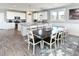 Open-concept kitchen and dining area with granite countertops and stylish decor at 1411-A N Ocean Blvd., Surfside Beach, SC 29575