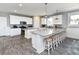 Open kitchen featuring an island with seating, stainless steel appliances, and granite countertops at 1411-A N Ocean Blvd., Surfside Beach, SC 29575