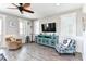 Cozy living room featuring coastal decor, comfortable seating, and plenty of natural light at 1411-A N Ocean Blvd., Surfside Beach, SC 29575