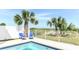 Inviting pool area featuring lounge chairs, palm trees, and landscaped surroundings at 1411-A N Ocean Blvd., Surfside Beach, SC 29575