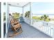 Relaxing porch area with rocking chairs offering ocean views and beach access at 1411-A N Ocean Blvd., Surfside Beach, SC 29575