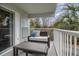 Relaxing balcony with seating offers outdoor enjoyment and views of lush greenery at 14290 Ocean Hwy. # 101, Pawleys Island, SC 29585