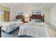 Comfortable bedroom showcasing two beds with coordinated linens and tranquil decor at 14290 Ocean Hwy. # 101, Pawleys Island, SC 29585