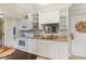 Bright and airy kitchen featuring granite countertops and stainless steel appliances at 14290 Ocean Hwy. # 101, Pawleys Island, SC 29585