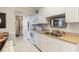 Bright and airy kitchen featuring granite countertops and stainless steel appliances at 14290 Ocean Hwy. # 101, Pawleys Island, SC 29585