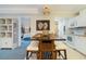 View of the dining area, Primary bedroom, and bathroom at 14290 Ocean Hwy. # 101, Pawleys Island, SC 29585