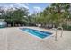 Inviting hot tub area surrounded by greenery and lounge chairs for ultimate relaxation at 14290 Ocean Hwy. # 101, Pawleys Island, SC 29585