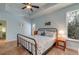 Bright main bedroom with a black metal bed frame, offering a peaceful retreat with natural light at 15 Flaggpoint Ln., Murrells Inlet, SC 29576