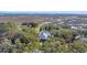 Aerial view of a home with a marsh view, surrounded by lush greenery and waterways at 161 Twelve Oaks Dr., Pawleys Island, SC 29585