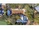 Aerial view of a home with lush landscaping, well manicured lawn, and a long driveway at 161 Twelve Oaks Dr., Pawleys Island, SC 29585