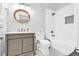 Bathroom with gray vanity, tiled floors, and tub shower combo with white subway tile surround at 161 Twelve Oaks Dr., Pawleys Island, SC 29585