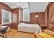 Cozy bedroom featuring wood paneled walls, and two windows providing natural light at 161 Twelve Oaks Dr., Pawleys Island, SC 29585