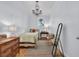 Cozy bedroom features a decorative chandelier, patterned rug, and natural light at 161 Twelve Oaks Dr., Pawleys Island, SC 29585