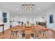 Open dining area with rustic table, chandelier, and plenty of space for entertaining at 161 Twelve Oaks Dr., Pawleys Island, SC 29585