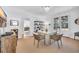 Dining area with a modern chandelier, seating for four, and lots of natural light at 161 Twelve Oaks Dr., Pawleys Island, SC 29585