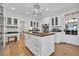 Bright kitchen with an island with wood countertop, white cabinetry, and stainless steel appliances at 161 Twelve Oaks Dr., Pawleys Island, SC 29585