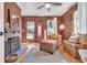 Comfortable living room featuring a fireplace, wood floors, and stylish furnishings at 161 Twelve Oaks Dr., Pawleys Island, SC 29585