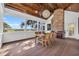 Bright screened-in porch with long views, wood flooring, and a large dining table at 161 Twelve Oaks Dr., Pawleys Island, SC 29585