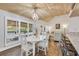 Cozy dining area with bright lighting, a charming chandelier, and comfortable seating at 163 Heron Marsh Dr. # 61, Pawleys Island, SC 29585