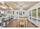 Elegant dining room with modern lighting, wood ceiling, and access to the breakfast bar with stainless steel appliances at 163 Heron Marsh Dr. # 61, Pawleys Island, SC 29585