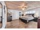 Spacious main bedroom boasts a wood plank ceiling, barn door, and an ensuite bathroom at 163 Heron Marsh Dr. # 61, Pawleys Island, SC 29585