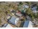 Aerial view of a single-Gathering home nestled among lush trees in a quiet neighborhood at 170 Minnow Dr., Pawleys Island, SC 29585