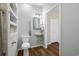 Stylish bathroom with a walk-in shower, a modern mirror over the sink and a built-in wall shelving unit at 170 Minnow Dr., Pawleys Island, SC 29585