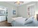 Cozy bedroom with hardwood floors, ceiling fan and attached bathroom at 170 Minnow Dr., Pawleys Island, SC 29585