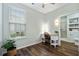 This bedroom features a work desk, natural lighting, and a full bathroom with a walk-in shower at 170 Minnow Dr., Pawleys Island, SC 29585