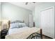 Comfortable bedroom with hardwood floors, ceiling fan, and a spacious closet at 170 Minnow Dr., Pawleys Island, SC 29585