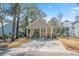 Charming single Gathering home featuring a welcoming front porch and large driveway at 170 Minnow Dr., Pawleys Island, SC 29585