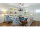 Cozy living room features a ceiling fan, lots of natural light and hardwood floors at 170 Minnow Dr., Pawleys Island, SC 29585