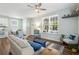 Bright living room featuring hardwood floors, lots of seating and a ceiling fan at 170 Minnow Dr., Pawleys Island, SC 29585