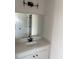 New bathroom features a sleek white vanity with black accents and a large mirror at 171 Glengrove Lane, Murrells Inlet, SC 29576