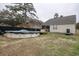 Backyard view featuring the exterior of the enclosed porch and above ground pool at 1741 Rice St., Georgetown, SC 29440