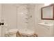 Bright bathroom featuring a stand-up shower with white tile surround and modern fixtures at 1741 Rice St., Georgetown, SC 29440