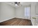 A basic bedroom features wood-look floors and natural light at 1741 Rice St., Georgetown, SC 29440