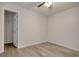 View of bedroom with neutral walls, ceiling fan, and wood-look floors with closet at 1741 Rice St., Georgetown, SC 29440