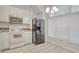 Well-lit kitchen with modern stainless steel appliances and tile flooring at 1741 Rice St., Georgetown, SC 29440