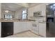 Bright kitchen with modern appliances, white cabinetry, and black dishwasher at 1741 Rice St., Georgetown, SC 29440