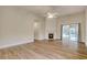 Bright living room features wood floors, a cozy fireplace, and open layout at 1741 Rice St., Georgetown, SC 29440