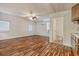 Open living space featuring wood-look floors, windows, mini-split AC, and kitchenette at 1741 Rice St., Georgetown, SC 29440