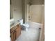 Bathroom featuring a single vanity, toilet, and shower/tub combo at 1742 Low Country Pl. # A, Myrtle Beach, SC 29577