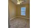 Neutral bedroom featuring carpeted floors and a window offering natural light at 1742 Low Country Pl. # A, Myrtle Beach, SC 29577