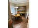 Bright dining area showcasing a wooden table, chairs, and hutch near a window at 1742 Low Country Pl. # A, Myrtle Beach, SC 29577