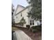 A yellow townhome featuring tidy landscaping and a sidewalk at 1742 Low Country Pl. # A, Myrtle Beach, SC 29577